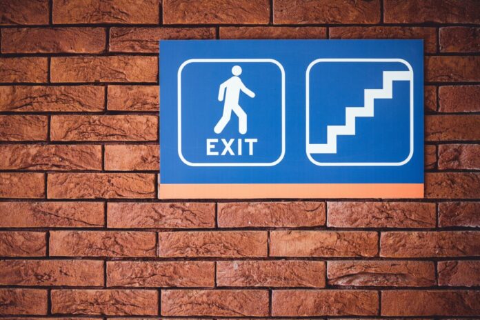 Gavin-Isaacs-Exits-Entain Exit Sign